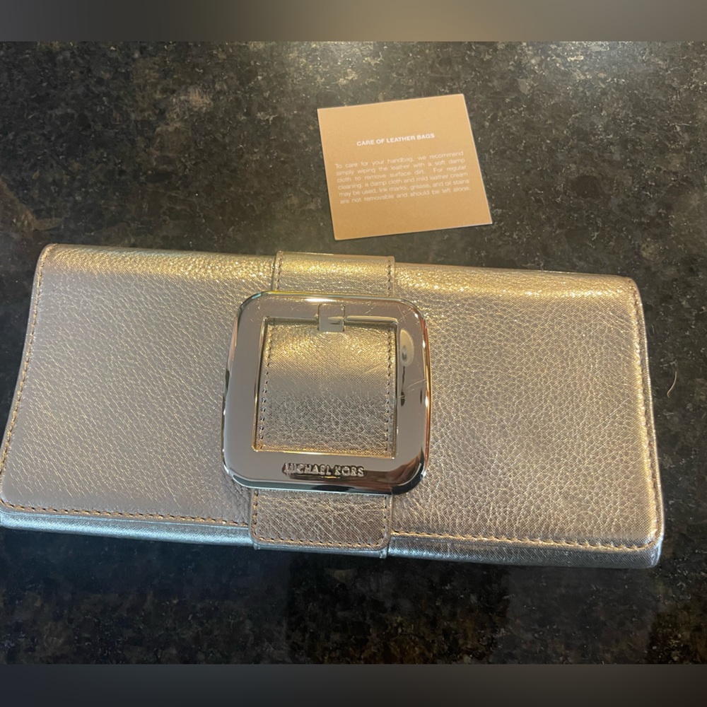 Metallic Michael Kors clutch bag
